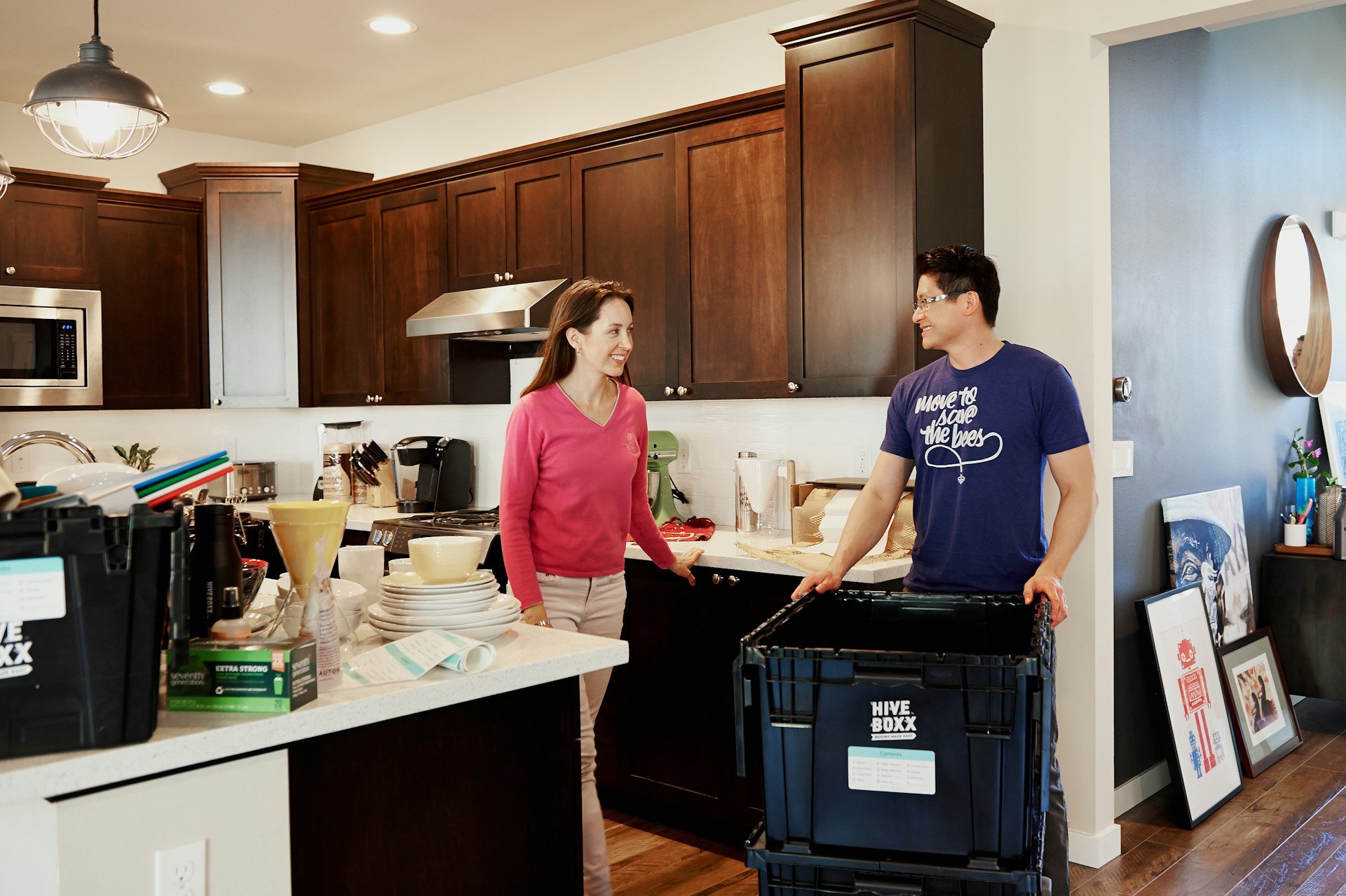 woman in blue crew neck t-shirt standing in kitchen